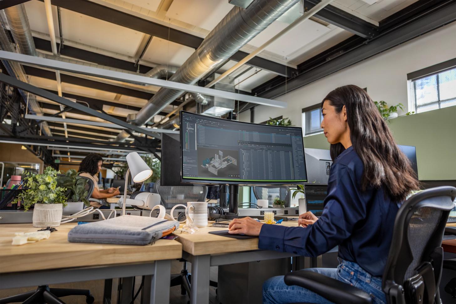 A developer works with an Autodesk program in an office.