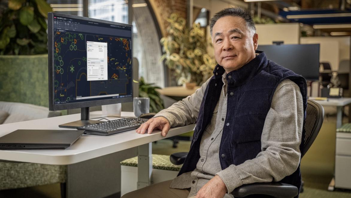 User sitting in front of a desktop computer